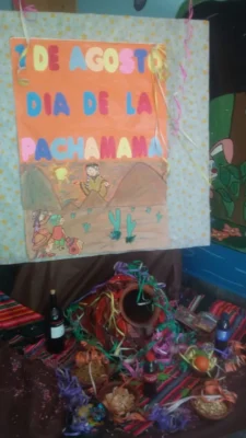 cartelera y ofrendas dia de la pachamama